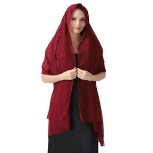 Detailed view of maroon chiffon shawl with silver threads and shimmering rhinestones.