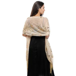 Detail view showing back of gold sequin embroidered mesh shawl with long tassel fringe