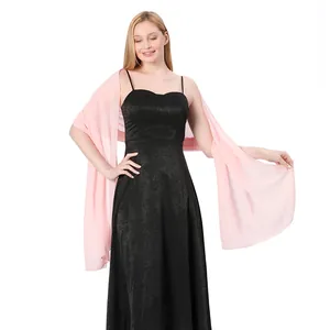 Pink chiffon shawl wrap details shown on model with black evening gown