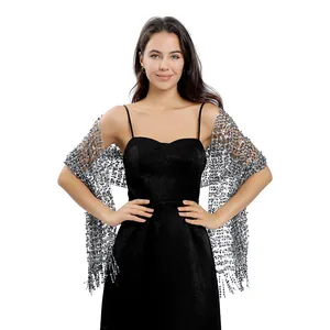 Detail shot of an elegant silver sequined mesh shawl featuring shimmering tassels