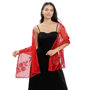 Detailed view of elegant red lace shawl with sequin peony embroidery on model