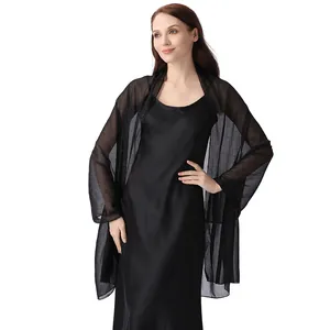 Detailed view of an elegant black chiffon shawl with silver silk and rhinestones