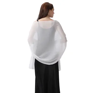 Rear view of a model wearing a shimmering white evening shawl over an elegant black dress