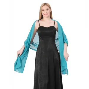 Model wearing a teal chiffon long shawl over a black formal dress for party dinner