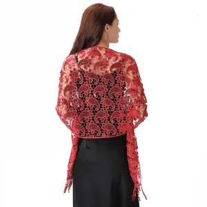 Detailed back view of a red sequin paisley lace shawl paired with a black evening gown