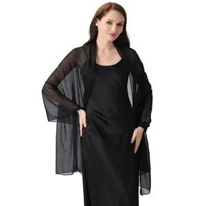 Close-up of black chiffon shawl featuring delicate silver threads and rhinestones