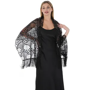 Detailed macro view showing black sequined peacock tail embroidery and elegant fringe