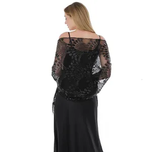 Close-up rear view of black sequin peacock tail embroidered shawl with tassels for dresses