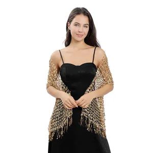 Detailed close-up of gold sequin embroidered mesh shawl for party evening dress