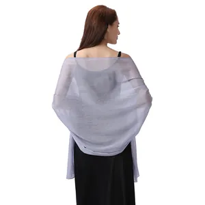 Elegant back view of a shimmering lavender sheer evening shawl paired with a black dress