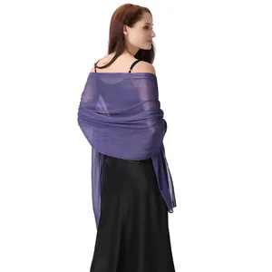 Detailed view of the sparkling purple chiffon shawl with silver threads on a model