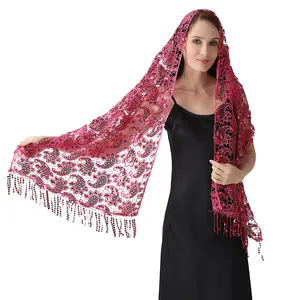 Close-up of bright pink sequined lace shawl featuring paisley patterns and elegant tassels