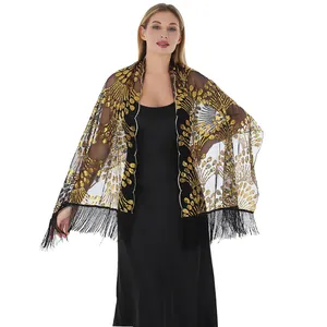 Gold sequin embroidered shawl with peacock tail pattern and tassels for evening wear.
