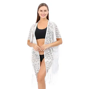 Elegante witte kanten bikini cover-up met geometrische patronen en franje aan zoom