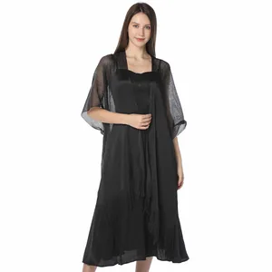 Elegant black metallic yarn shawl featuring shimmering silk and fringe detail on model
