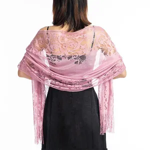 Back view detail of pink floral hollow lace shawl with elegant fringe and tassels