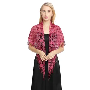 Detail view of hot pink lace shawl with sequins and fringe tassels for evening parties
