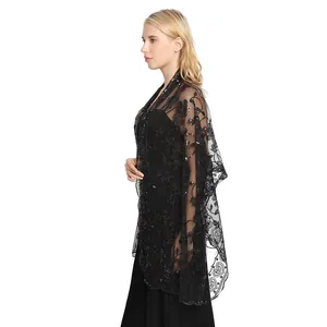 Detail showing the intricate floral sequin embroidery on a black mesh wedding shawl
