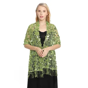 Detail of green sequin lace shawl with tassels for formal evening party dresses