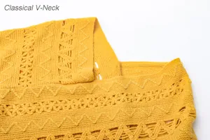 Close-up of classical V-neck detail on yellow minimalist knitted hollow-out poncho