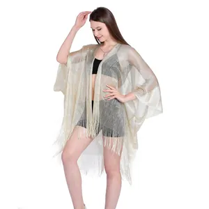 Elegant gold metallic fringe bikini cover-up for beach vacations