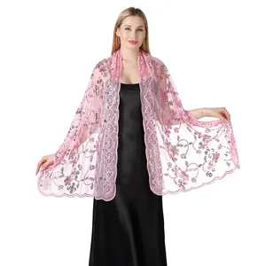 Detail view of pink sequin embroidered lace shawl for elegant evening or bridal wear