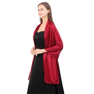 Elegant red satin shawl wrap accessory worn with a black evening dress for bridesmaids