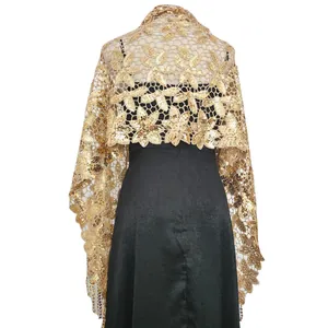 Detailed view of a gold sequin floral shawl with elegant fringe for evening party dresses