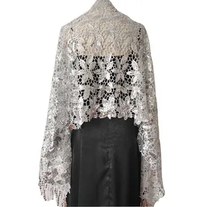 Detailed back view of a silver sequin lace shawl with elegant tassels for evening gowns