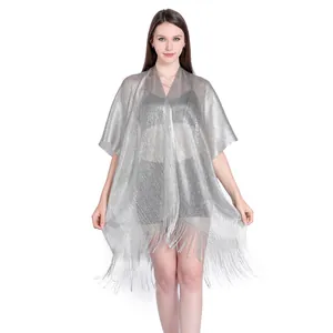 Detailed view of silver metallic lurex shawl with fringes for beach bikini cover-up