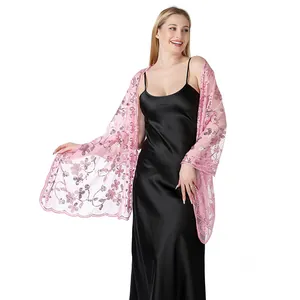 Elegant pink sequined flower shawl shown in detail on model with black evening dress