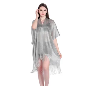 Detailed view of the silver metallic fringed beach cover-up featuring split sleeves