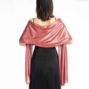Elegant rose gold pashmina satin shawl draped over shoulders showing back view