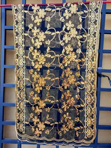 Elegant black mesh shawl featuring detailed gold floral sequin embroidery for evening dresses