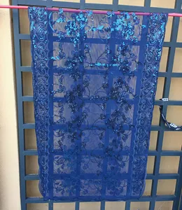 Detailed view of the elegant blue floral lace shawl with shimmering sequin embroidery