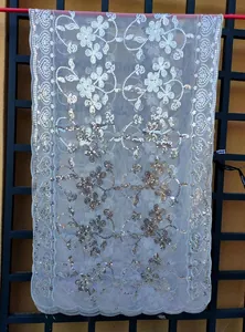 Elegant white sheer mesh shawl with floral sequin patterns and scalloped edges