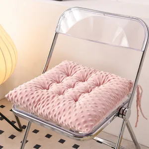 Close-up of a pink minky bubble seat cushion on a modern transparent folding chair