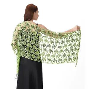 Detailed back view of a light green sequined paisley lace shawl for evening wear.