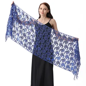 Detail of royal blue water-soluble lace shawl with sequin paisley pattern for evening wear
