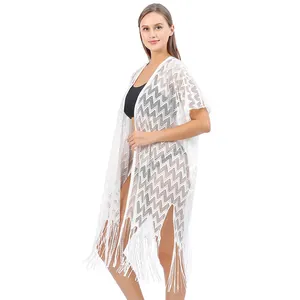 Copricostume in pizzo bianco all'uncinetto con motivo a zigzag e orlo con frange lunghe