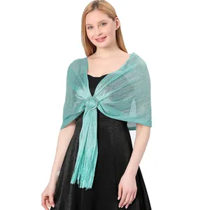 Close-up of elegant teal metallic silk shawl with sparkling thread and silver buckle.