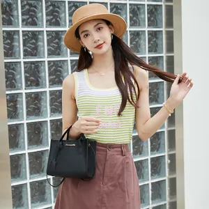 Elegant black litchi grain small handbag with detachable crossbody strap for women