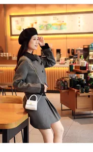 Elegant white mini crossbody bag with pearl handle and gold chain strap in a cafe setting
