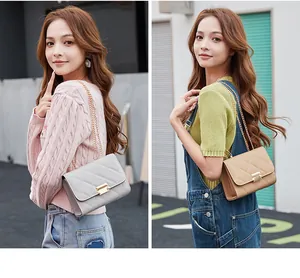 Asian model showcasing grey and beige quilted chain shoulder bags for women in a street setting.