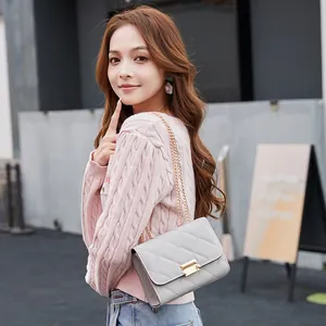 Elegant grey quilted shoulder bag with gold chain strap for stylish women