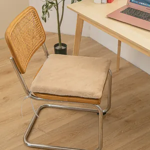 Cozy plush heated seat cushion for office chairs placed in a warm home study room