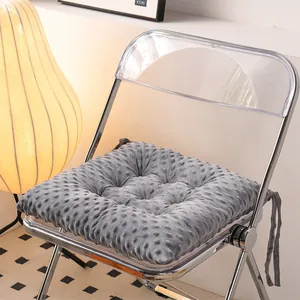 Macro detail view of a thick gray dotted plush seat cushion tied to a modern chair