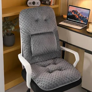 Macro view of grey dotted plush one-piece office chair cushion with tufted detail