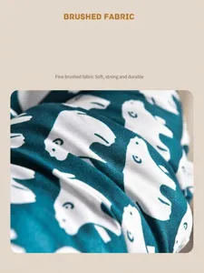 Close-up of teal chair cushion fabric with white bear patterns and soft brushed texture