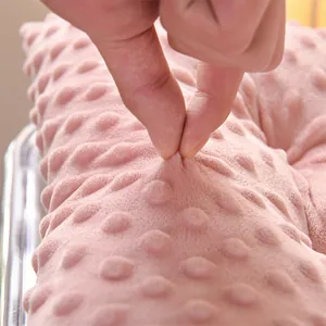Close-up of soft pink dimple fleece seat cushion showing thick plush texture.